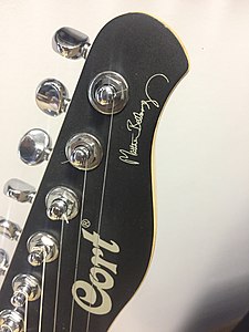 Headstock in front with signature