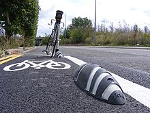 A cycle lane protected by Zicla-brand armadillo Cycle lane and Zicla traffic segregators, Temple Mills Lane E10.jpg