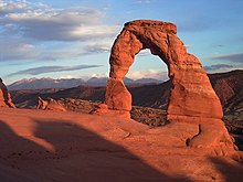 Abbey's narrative follows his experiences as a ranger at Arches National Monument in the late 1950s Delicate arch sunset.jpg