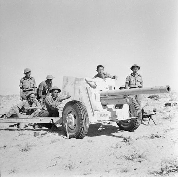 A US-built 57mm M1A1 or M1A2 copy of the 6-pounder anti-tank gun and its crew in action in the Western Desert, November 1942.