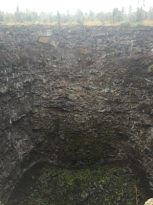 Western rim of Devil's Throat pit crater in June 2016 Devil's throat pit crater.jpg