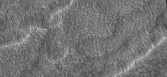 Close up of scalloped ground, as seen by HiRISE under HiWish program. Surface is divided into polygons; these forms are common where ground freezes an