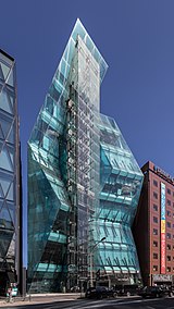 Facade of the polyhedral glass building The Iceberg, Shibuya, Tokyo, Japan.jpg
