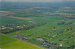 Aerial view of exurban Monroe Township farmland in the 1960s. Since then, significant new housing construction has generated an increasingly suburban environment. Fcc2.jpg