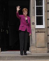 Sturgeon arrives at Bute House following election victory in the 2021 Scottish Parliamentary elections First Minister arrives at Bute House (51166819042).jpg