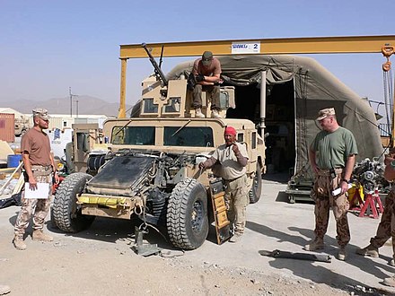 Humvee maintenance with engine exposed by Czech Army in Afghanistan