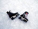 Ice hockey skates on ice.jpg