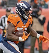Javonte Williams, a Running back for the Denver Broncos, a professional American football franchise based in Denver Javonte Williams 2021 (51650645333) (cropped).jpg