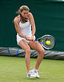 Katy Dunne competing in the first round of the 2015 Wimbledon Qualifying Tournament at the Bank of England Sports Grounds in Roehampton, England. The winners of three rounds of competition qualify for the main draw of Wimbledon the following week.