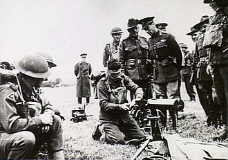 King George VI inspecting the skills of one of the 2/1st's machine gunners, 1940 King George VI inspecting the Australian 2-1st Machine Gun Battalion (AWM photo 004510).jpg