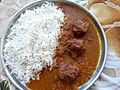 Vegetable kofta curry, served with boiled rice in India.