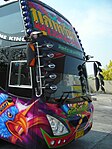 Large coach in Thailand with many mirrors