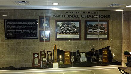 National football championship trophy room at Bearcat Stadium at Northwest Missouri State University. The two trophies in the middle are for the team's 1998 and 1999 national championships. The four trophies on the left are for appearances in the 2005–2008 title games.