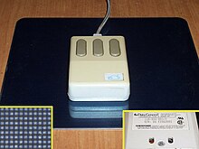 OEM-branded Mouse Systems (Kirsch) optical mouse showing underside and mousemat pattern. Old optical mouse.jpeg