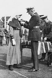 Pearl Corkhill is presented with the MM by the Governor-General