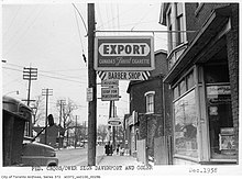 An advertisement for Export cigarettes in Toronto, c. 1958 Pedestrian crossing sign at Davenport Road and Osler Street Toronto.jpg
