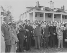 Photograph of Secretary of State George C. Marshall pointing out landmarks at Mount Vernon to Mexican President Miguel Aleman, as other dignitaries look on. Photograph of Secretary of State George C. Marshall pointing out landmarks at Mount Vernon to Mexican President... - NARA - 199551.tif