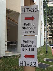 Signs pointing to polling stations in Clementi, in Holland-Bukit Timah GRC Polling station signs, Holland-Bukit Timah GRC, Singapore - 20150911.jpg