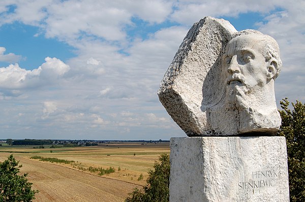 Monument atop Sienkiewicz Mound at Okrzeja. At left is the writer's family's village, Wola Okrzejska, where he was born.