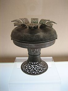 Spring and Autumn period pu bronze vessel with interlaced dragon design Pu with openwork interlaced dragons design.jpg