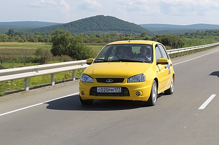 Russian PM Vladimir Putin drives the newly-paved Amur Highway in a Lada Kalina in 2010