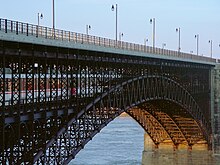 The 1874-built Eads Bridge carries MetroLink across the Mississippi River between Missouri and Illinois on its lower-level rail deck. SaintLouisMetroLinkEadsBridge.jpg