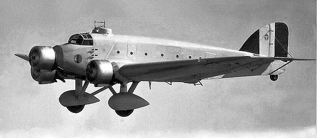 Nationalist aircraft bomb Madrid in late November 1936. Fiat CR 32s, flown by Italian pilots, provide fighter cover.