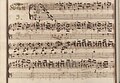 partitura scrisă de mână îmbunătățită cu culori roșii și albastre estompate pe margini