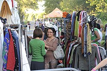 Women mingling at a clothing swap. SceneAtClothingSwap.jpg