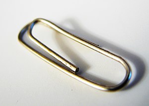 Photo of a small white paper clip.