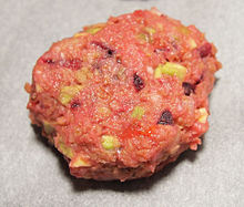 A vegetarian patty prepared from crushed soybean, avocado, tomato and beetroot. Soy crush steak.jpg