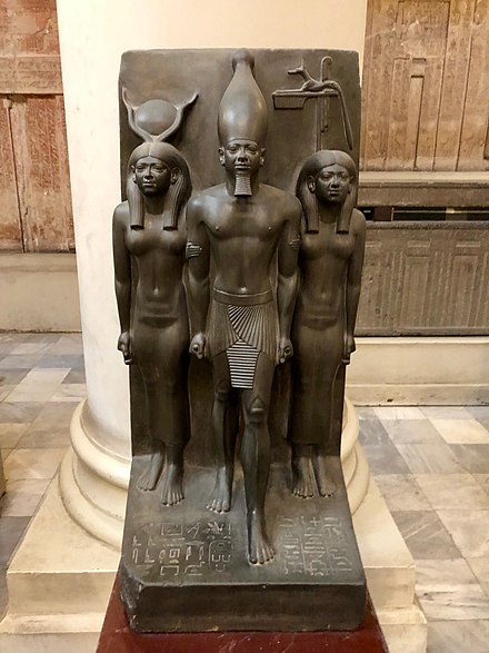 Anput (right) depicted on a triad statue with Hathor and the Pharaoh Menkaure