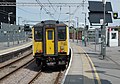 2014-07-27 12:40 Greater Anglia 317884 stands at Stratford.