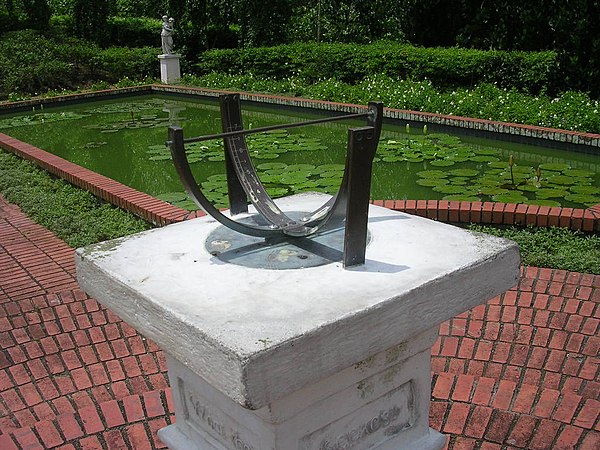 Bowstring sundial in Singapore Botanic Gardens. The design shows that Singapore is located almost at the equator.