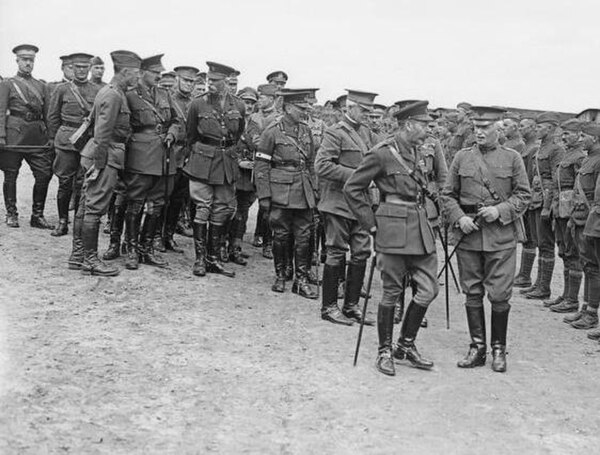 British King George V, along with Major General Edward M. Lewis, commander of the U.S. 30th Division, review elements of Lewis's division in France, A