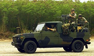 Marines from Weapons Company (WC), 2nd Battalion, 4th Marine Regiment race their Mercedes Interim Fast Attack Vehicle (IFAV) that is equipped with the Mk19 along the North Field, on Tinian Island, in support of Exercise Tandem Thrust 2003. USMC Fast Attack Vehicle (IFAV).1.JPEG