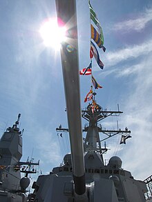 Forward 5 in/62 caliber gun of USS Gravely. Taken during Fleet Week 2012 in Boston. The superstructure of a German destroyer is in the left background. USS Gravely Forward gun.JPG