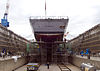 US Navy 090323-N-3215T-024 Contractors from the Fleet Activities Yokosuka Ship Repair Facility perform maintenance on the guided-missile destroyer USS Lassen (DDG 82) as it rests in dry dock.jpg