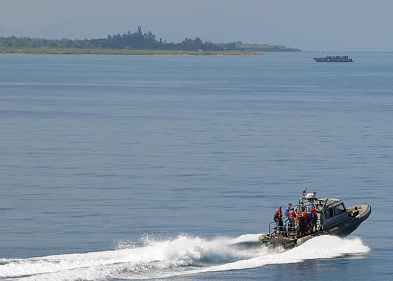 File:US Navy 100208-N-1082Z-062 A rigid hull inflatable boat from the amphibious dock landing ship USS Ashland (LSD 48), carries sailors to the multi-purpose amphibious assault ship USS Nassau (LHA 4) near the Haitian coast.jpg