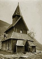 View of Urnes stave church by Axel Lindahl, 1880s, with the ancient portal in the north wall Urnes stavkyrkje old.jpeg