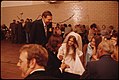WEDDING DANCE HELD IN THE TURNER CLUB GYMNASIUM IN NEW ULM, MINNESOTA FOLLOWING THE CHURCH CEREMONY. NEW ULM IS A... - NARA - 558240.jpg