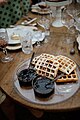 Waffles on a tray with two small glass bowls of fruit glaze - 51642490145.jpg
