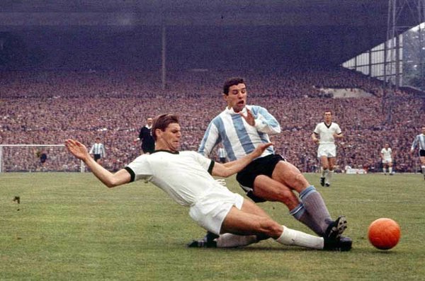 Wolfgang Weber (left) and Luis Artime during the match between West Germany and Argentina in Birmingham