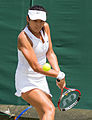 Yang Zhaoxuan competing in the third round of the 2015 Wimbledon Qualifying Tournament at the Bank of England Sports Grounds in Roehampton, England. The winners of three rounds of competition qualify for the main draw of Wimbledon the following week.