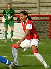 Scott playing for Arsenal in 2006, with Emma Byrne looking on Alex Scott.jpg