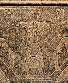 Atlanersa holding up the heavens, on a stand for a boat shrine of Amun-Re Atlanersa holding up the heavens.jpg