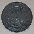Japanese bronze mirror with design of two cranes in flight and pine needles, Japan, 12th century AD.