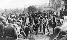 crowd of people with some digging