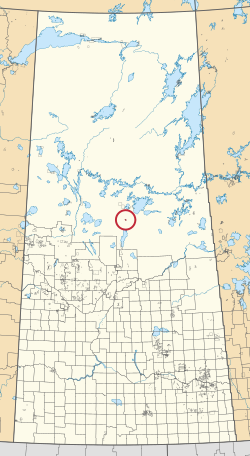 Saskatchewan vilayetinin 297 kırsal belediyesini ve yüzlerce küçük Kızılderili rezervini gösteren bir haritası. Biri kırmızı bir daire ile vurgulanmıştır.