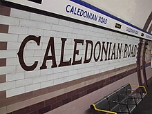 The distinctive nameplate and tilework pattern Caledonian Road stn tiling.JPG